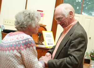 Irene Mannix greets former resident Jim Hamill on the house tour. (Photo by Lisa Aciukewicz)